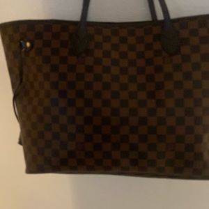 Brown Louis Vuitton bag with red interior